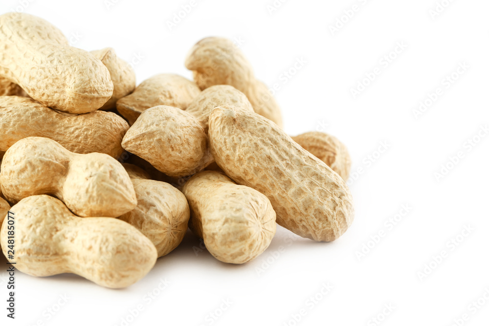 Peanuts. Two peeled nuts isolated on white background. Peanut macro.