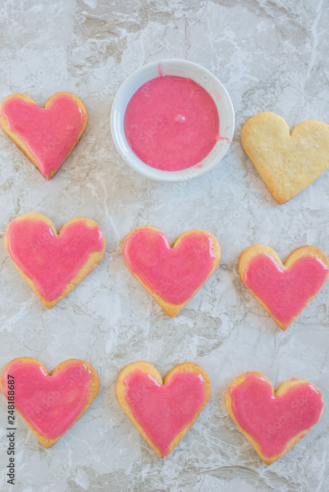 Heart shaped cookies with pink icing Heart shaped cookies with pink icing