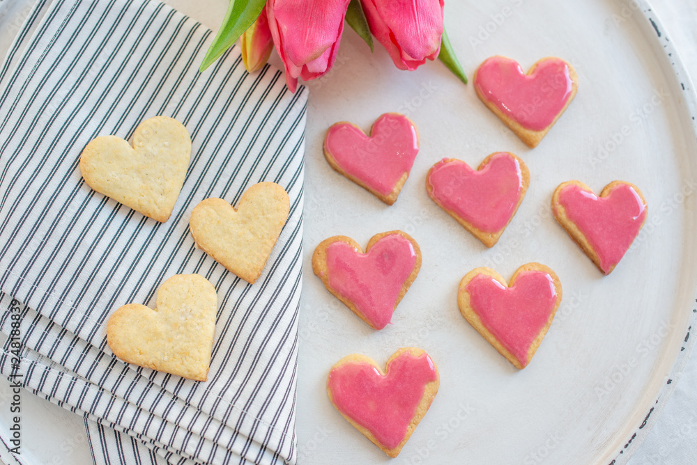 Heart shaped cookies with pink icing Heart shaped cookies with pink icing
