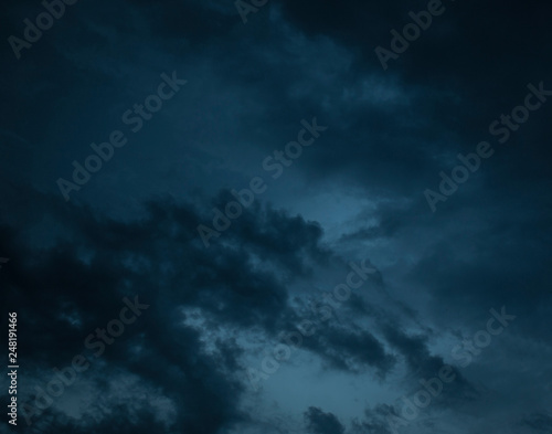 cloudy blue sky with dark blue clouds