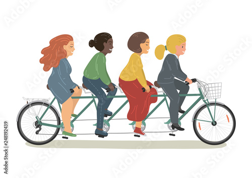 Four women riding tandem bicycle together.