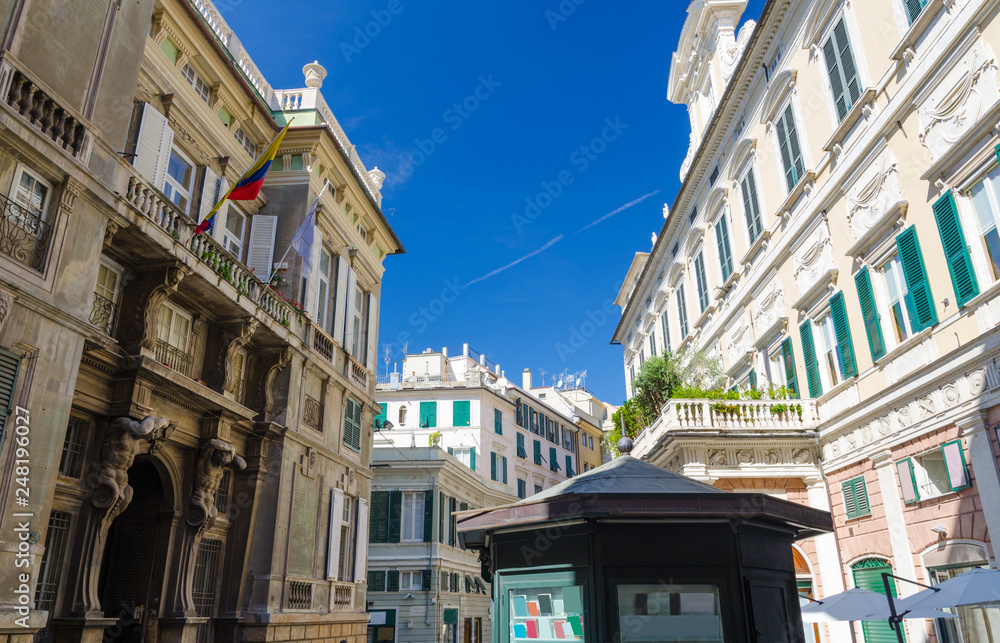 Palace Palazzo Grimaldi della Meridiana, typical colorful classic style buildings and old bookstall kiosk on Piazza della Meridiana square in historical centre of city Genoa (Genova), Liguria, Italy