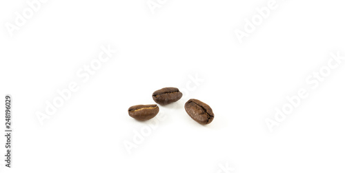 Three coffee beans on white background