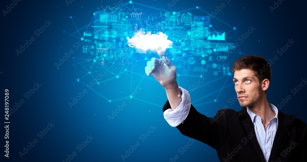 Man touching hologram projection displaying information from cloud based system
Man touching hologram projection displaying information from cloud based system
