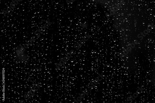 Droplets of water on black glass