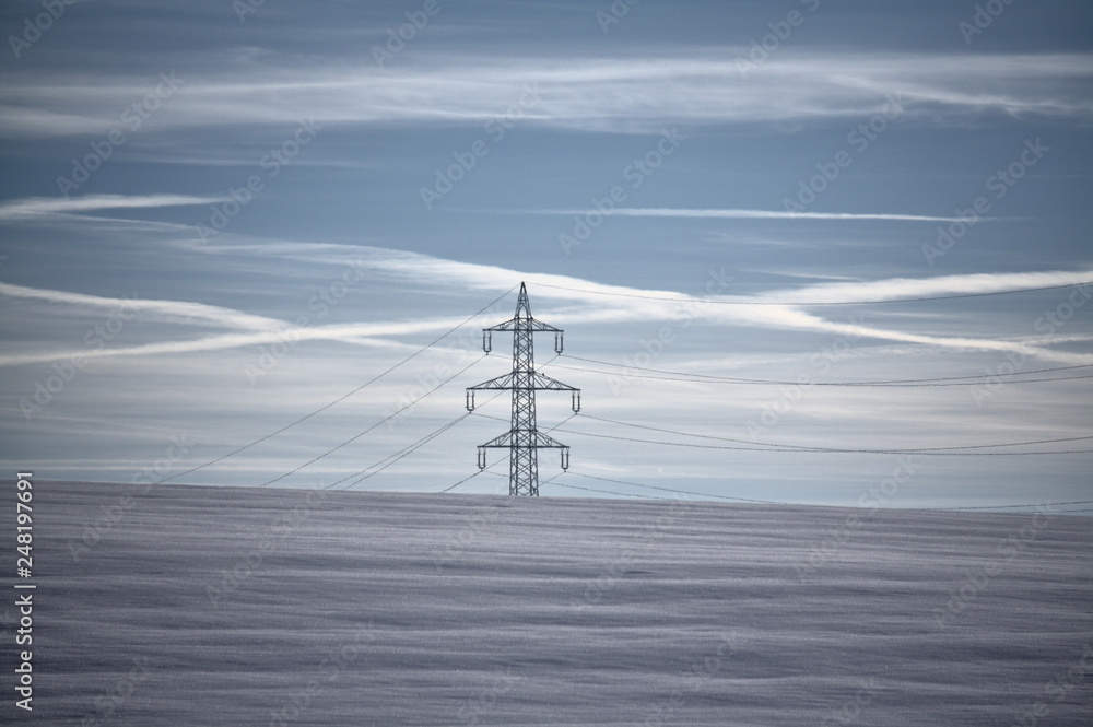 power transmission line in winter landscape