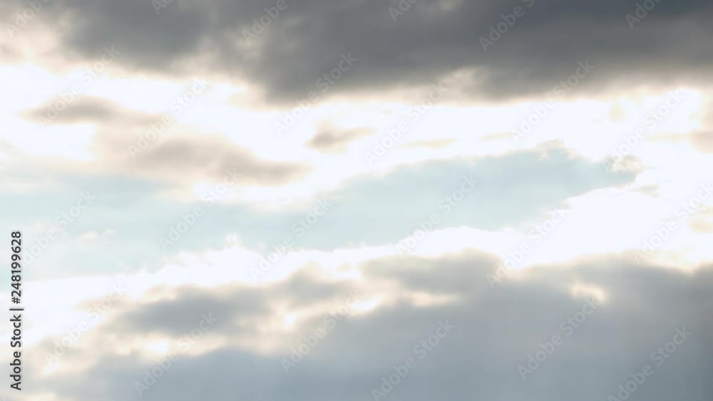 Beams sun, cloudscape with large, building clouds and sunrise 
