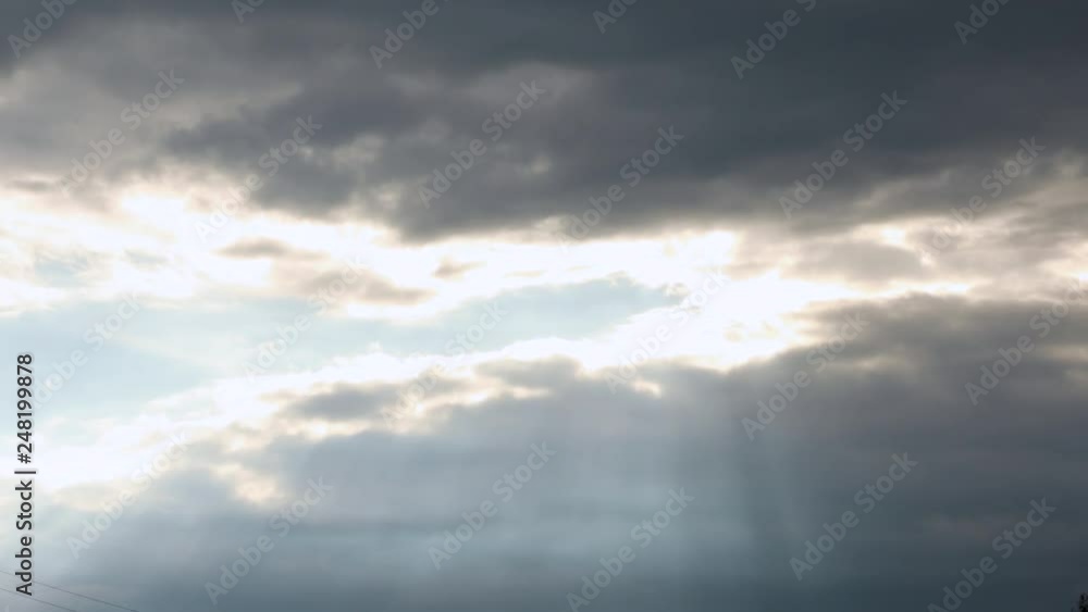 Beams sun, cloudscape with large, building clouds and sunrise Beams sun, cloudscape with large, building clouds and sunrise