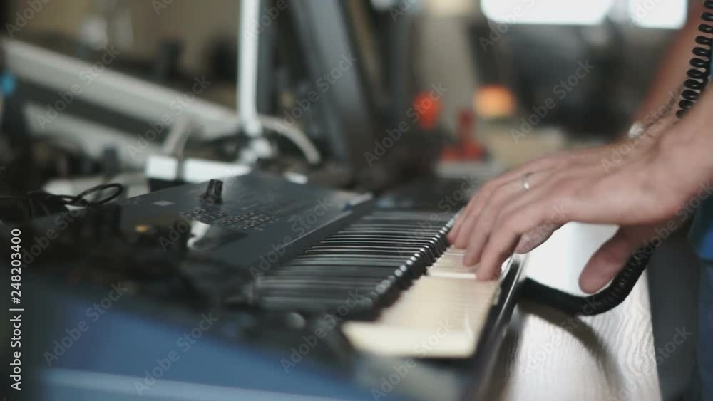 Detail of hands playing music on electric piano Detail of hands playing music on electric piano