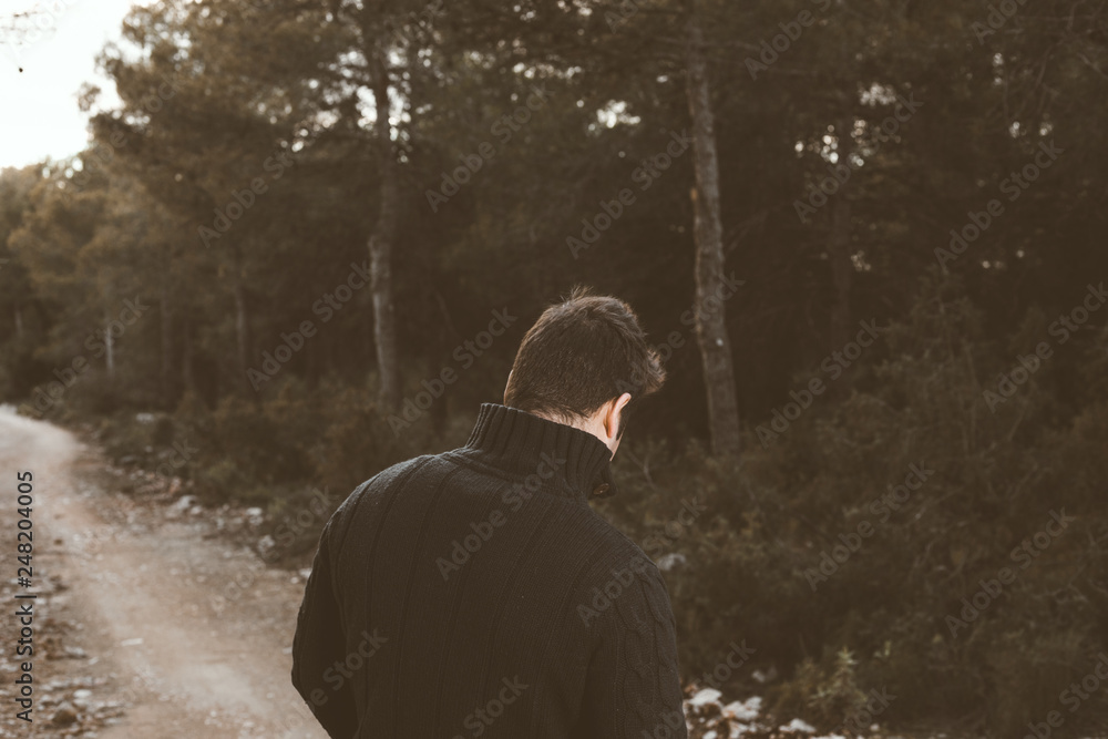 Portrait of a modern guy in a forest.Photo style social networks Portrait of a modern guy in a forest.Photo style social networks