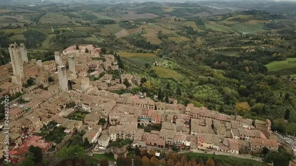 Aerial view of San Gimignano, a medieval town in Tuscany. Panoramic view of a rural landscape in Italy. Aerial view of San Gimignano, a medieval town in Tuscany. Panoramic view of a rural landscape in Italy.