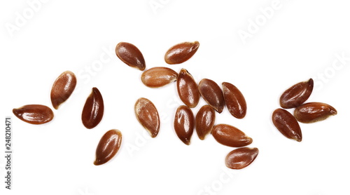 pile flax seeds isolated on white background, top view, macro linseed