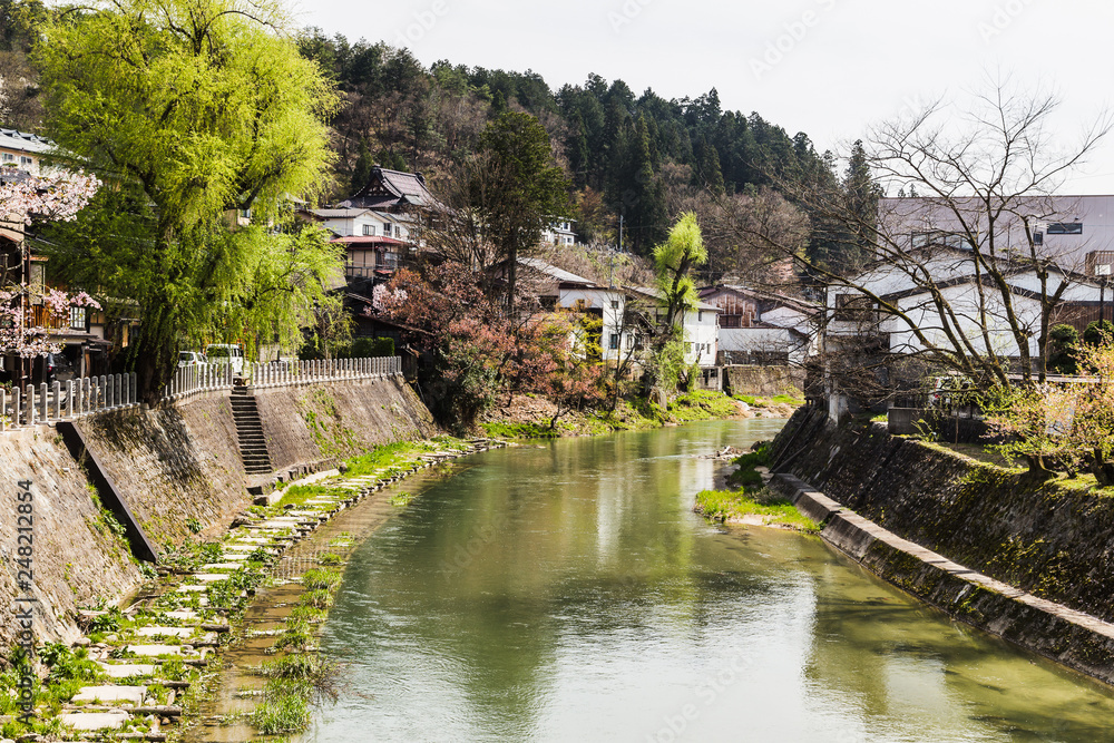 Bridge and water canal in Takayama village of old Japan Bridge and water canal in Takayama village of old Japan