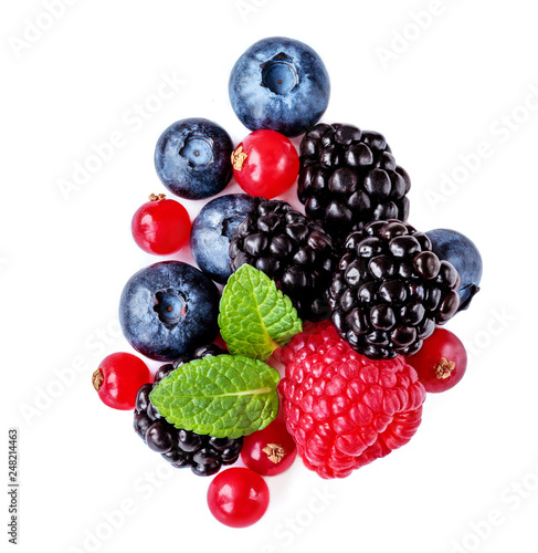 Isolated mixed berries. Raspberry, Blueberry, Cranberry, Blackberry and Mint leaves on white background. Top view.