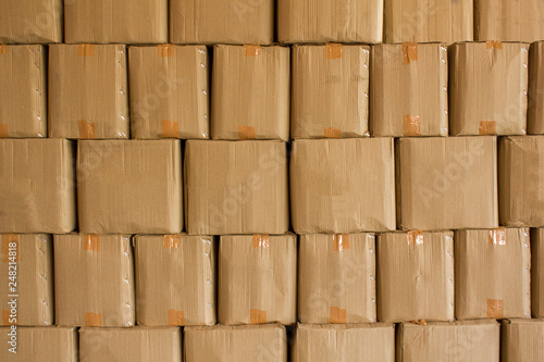 beige cardboard boxes stand in stack. rough surface texture