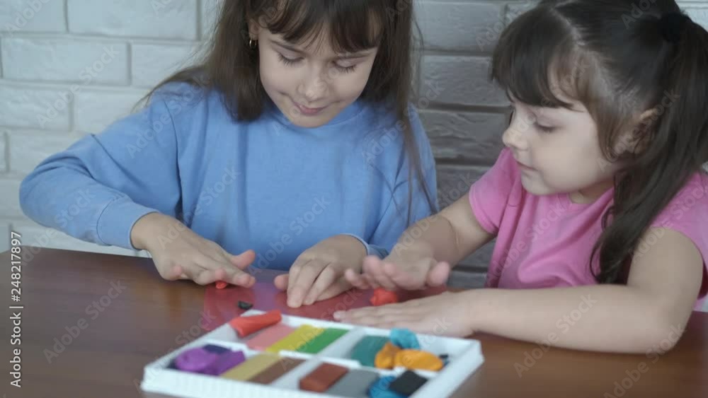 Children with plasticine. Small children sculpt from plasticine. Children with plasticine. Small children sculpt from plasticine.