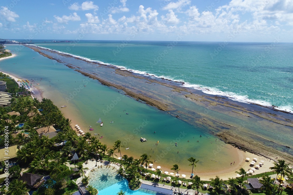 Aerial view of Muro Alto’s Beach, Porto de Galinhas, Brazil: Vacation in the paradisiac beach with fantastics natural pools. Great beach view. Travel destination. Vacation travel. Perfect vacation!