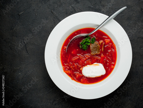 Traditional Ukrainian Russian borscht with white beans on the bowl
