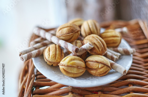 Traditional russian festive cookies in nut shape with caramelized milk inside