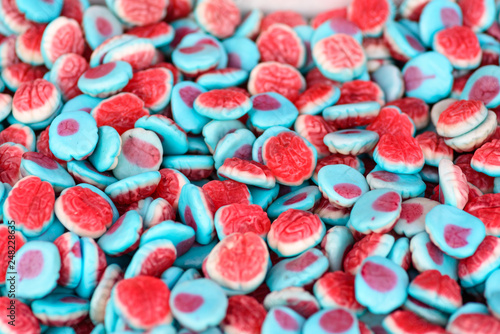 gummy brain candy, blue and red background