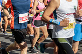 Runners during City Marathon Race Event in Summer Time