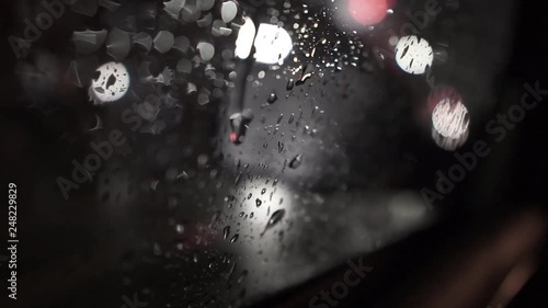 Raindrop on a car windshielf // moody // night photo