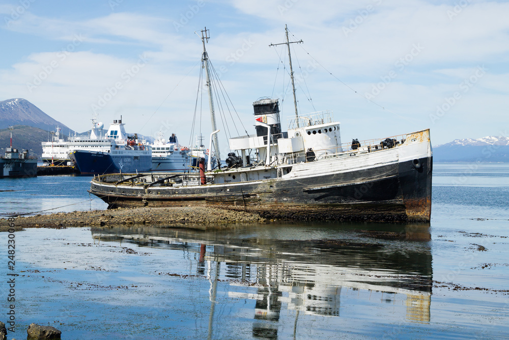 Fototapeta premium Beached ship on Ushuaia port, Argentina landscape