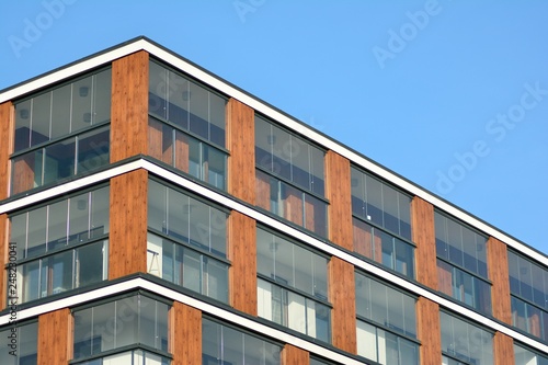 Modern apartment buildings on a sunny day with a blue sky. Facade of a modern apartment building