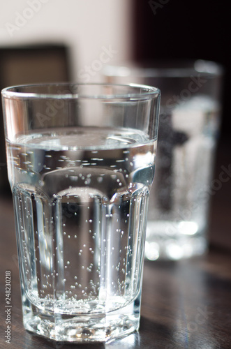 Glass with mineral water on the table