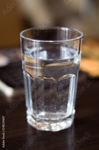 Glass with mineral water on the table