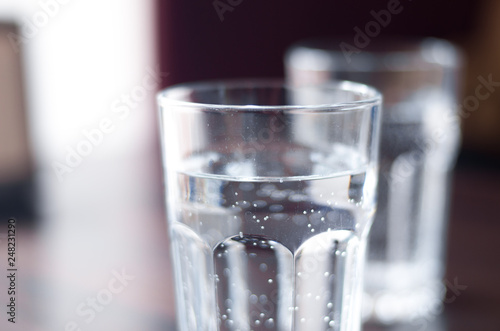 Glass with mineral water on the table