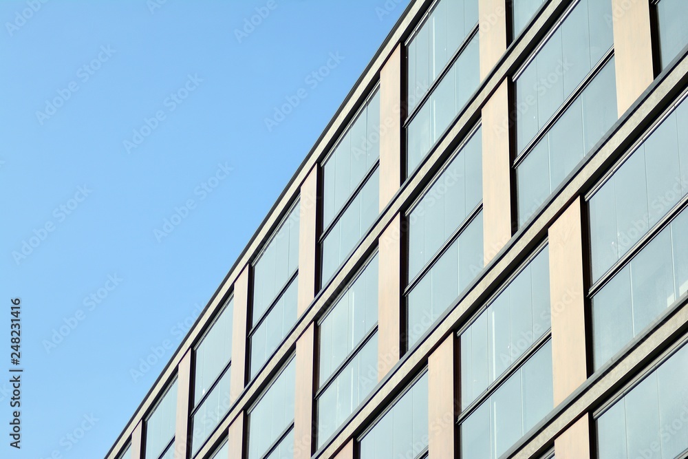 Modern apartment buildings on a sunny day with a blue sky. Facade of a modern apartment building Modern apartment buildings on a sunny day with a blue sky. Facade of a modern apartment building