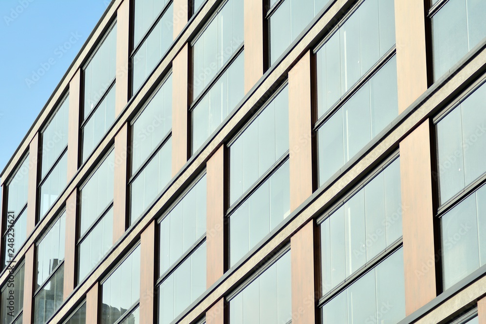 Modern apartment buildings on a sunny day with a blue sky. Facade of a modern apartment building Modern apartment buildings on a sunny day with a blue sky. Facade of a modern apartment building