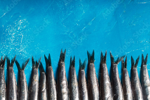 Seafood. Small sea fish, anchovies. Top view, fish pattern