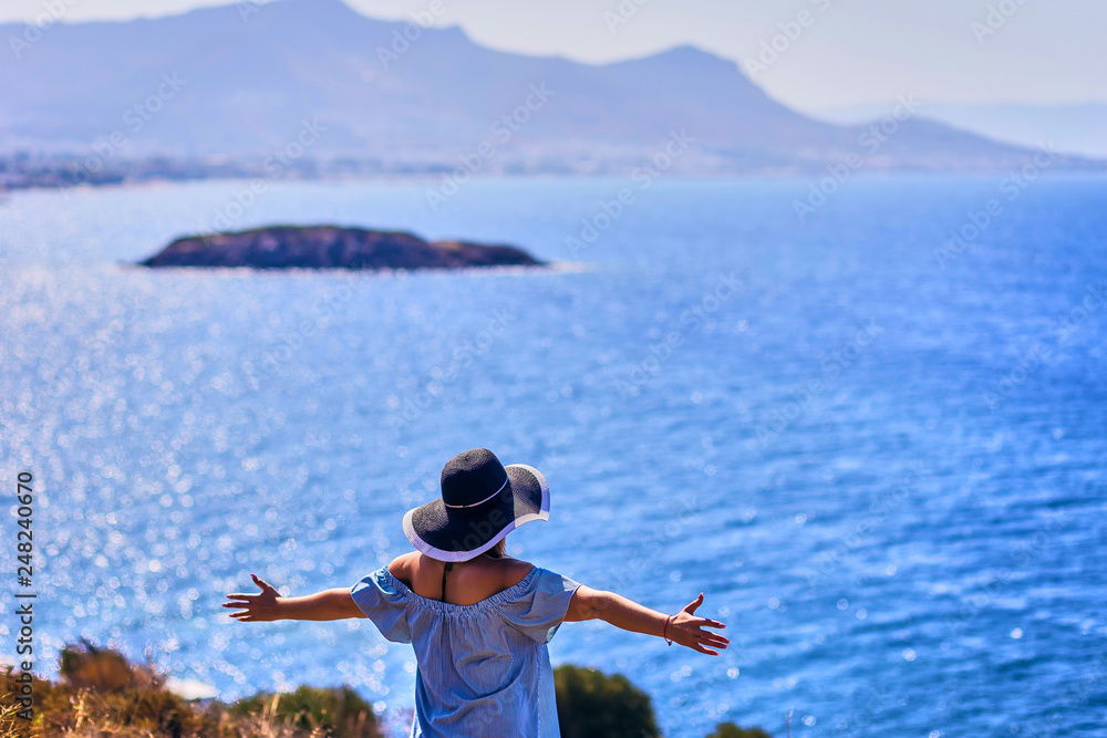 Beautiful woman in beach hat enjoying sea view with blue sky at sunny day in Bodrum, Turkey. Vacation Outdoors Seascape Summer Travel Concept