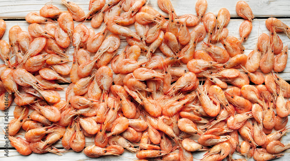 Shrimps background texture. A lot of sea shrimp or pattern of krill. Seafood like shrimp or krill on the street food festival. Shrimps background texture. A lot of sea shrimp or pattern of krill. Seafood like shrimp or krill on the street food festival.