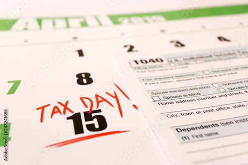 2019 calendar with 1040 income tax form for 2018 showing tax day for filing on April 15