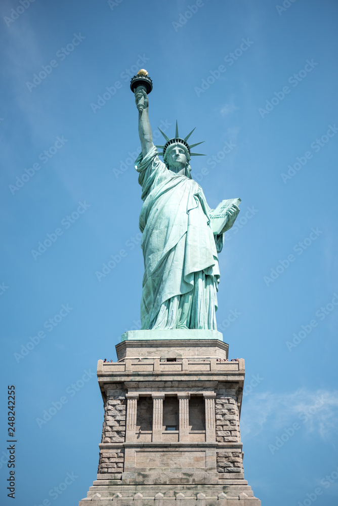 The Statue of Liberty isolated against the sky The Statue of Liberty isolated against the sky