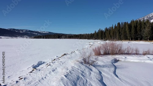 Dramatic aerial flying over majestic winter landscape in Montana photo