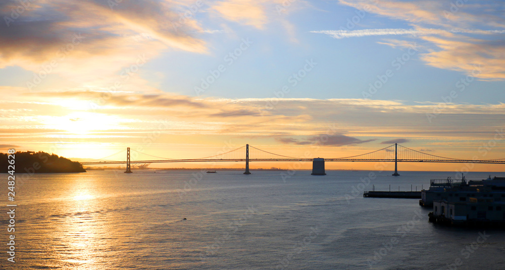 San Francisco to Oakland Bay Area Bridge. Sunrise silhouette of Bay Bridge. California, USA