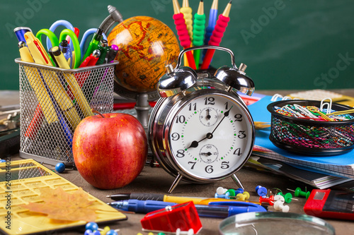 Back to school. Items for school activities rotate on the table.