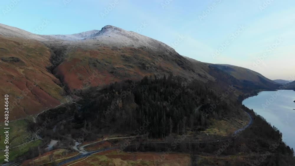Video „An aerial shot moving away from Helvellyn peak covered in a thin