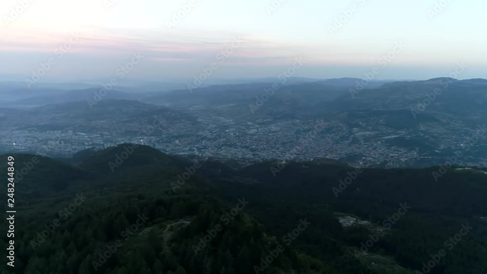 aerial view of fire and smoke in mountain forest on slopes hills wild fire in mountains with urban city area in danger aerial view of fire and smoke in mountain forest on slopes hills wild fire in mountains with urban city area in danger