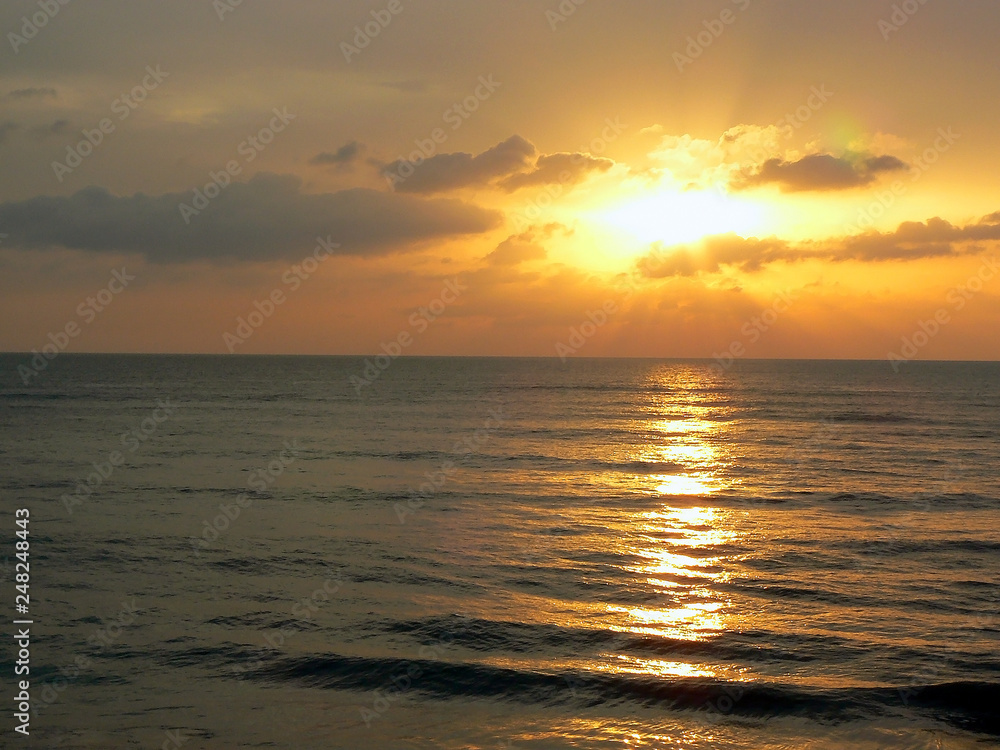 sunset on the coast of the beach bay of the city of Cadiz, Andalusia. Spain. Europe