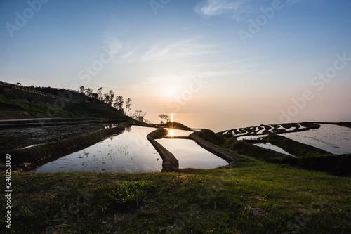 Sunset over rice paddies on Japan's Noto Hanto Peninsula photo