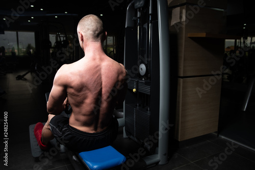 Bodybuilder Exercising Back In Gym © Jale Ibrak
