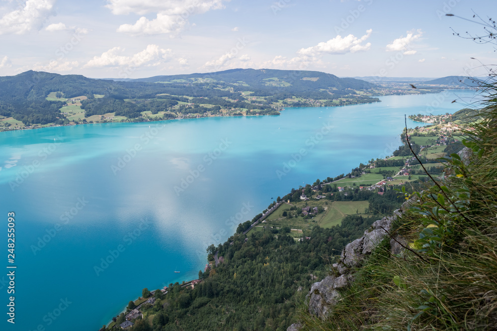 Attersee lake in Austria, with clouds reflecting in, as seen from above, on a clear, Summer day. European holiday destination near Salzburg.