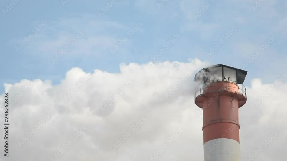 Climate problems abstract, industrial zone with a large red and white pipe Climate problems abstract, industrial zone with a large red and white pipe