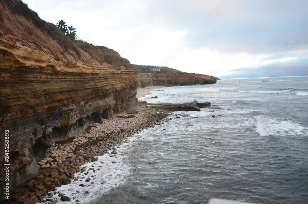 View of San Diego's Cliffs's edges merging into the sea at the end of the afternoon