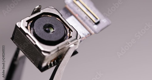 Wallpaper Mural Use tweezers to hold digital spy camera Torontodigital.ca